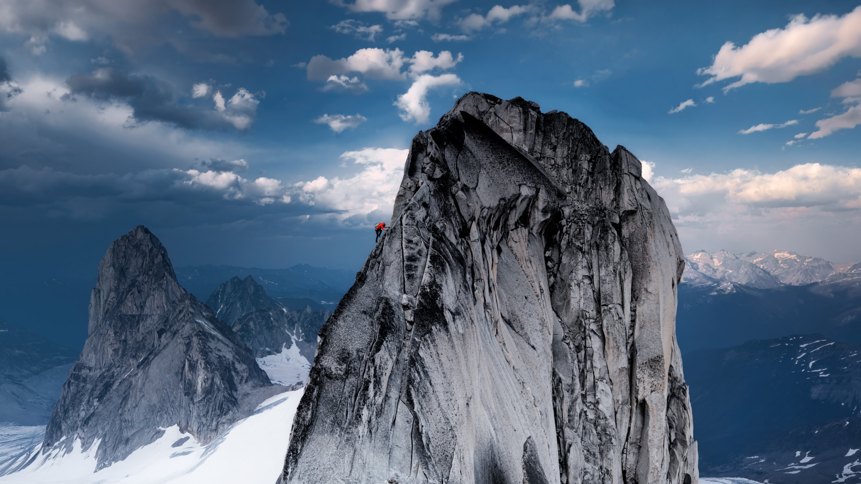 A climber ascending a snow-covered mountain, photographed by Jimmy Chin on iPhone 18 Pro.