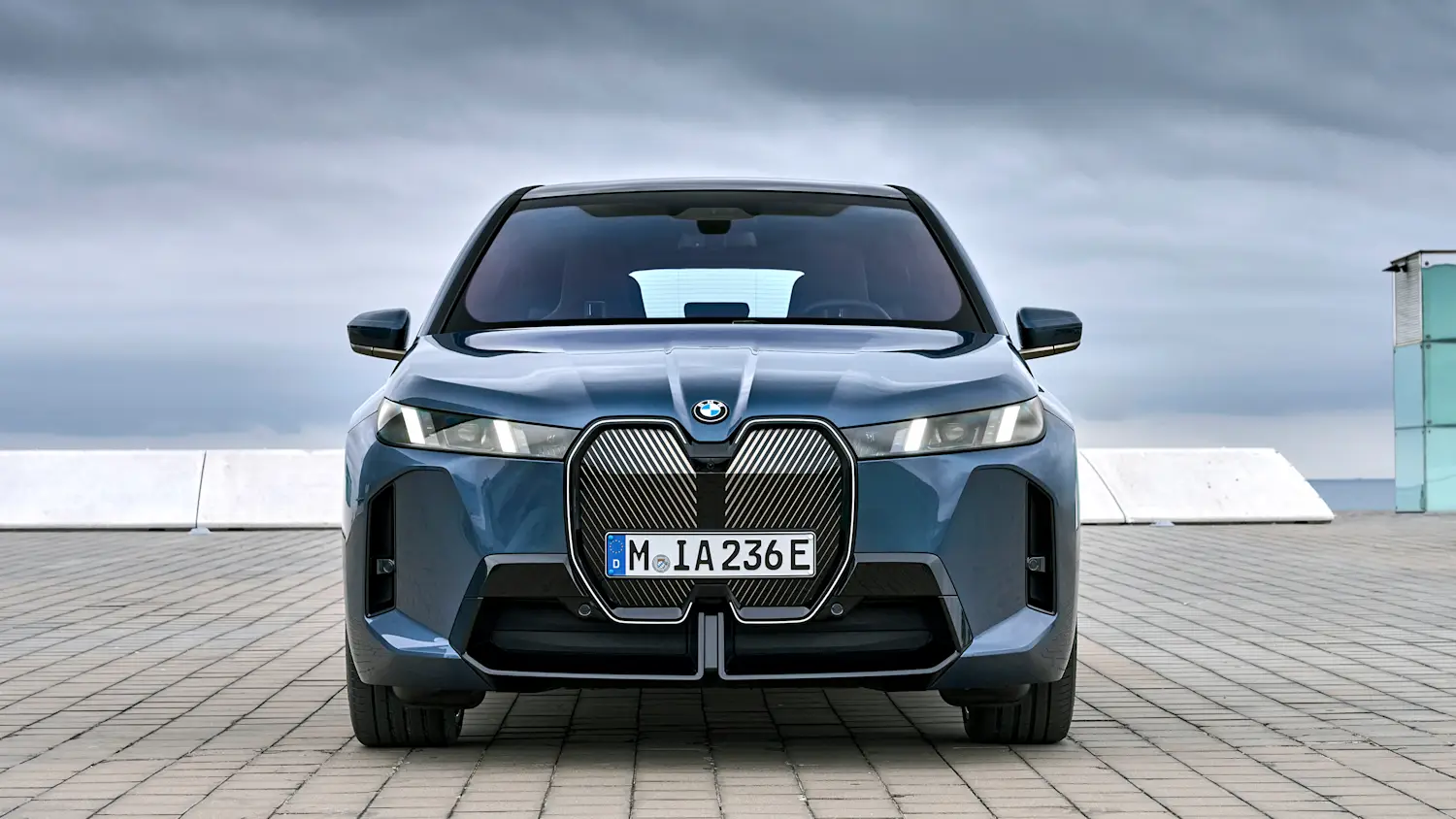 BMW iX photographed outdoors, used to illustrate EV charging efficiency.