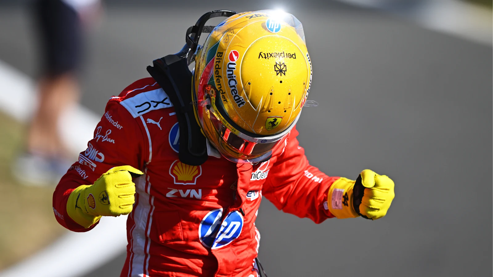 Lewis Hamilton celebrating in Ferrari race gear after British Grand Prix Sprint Qualifying.