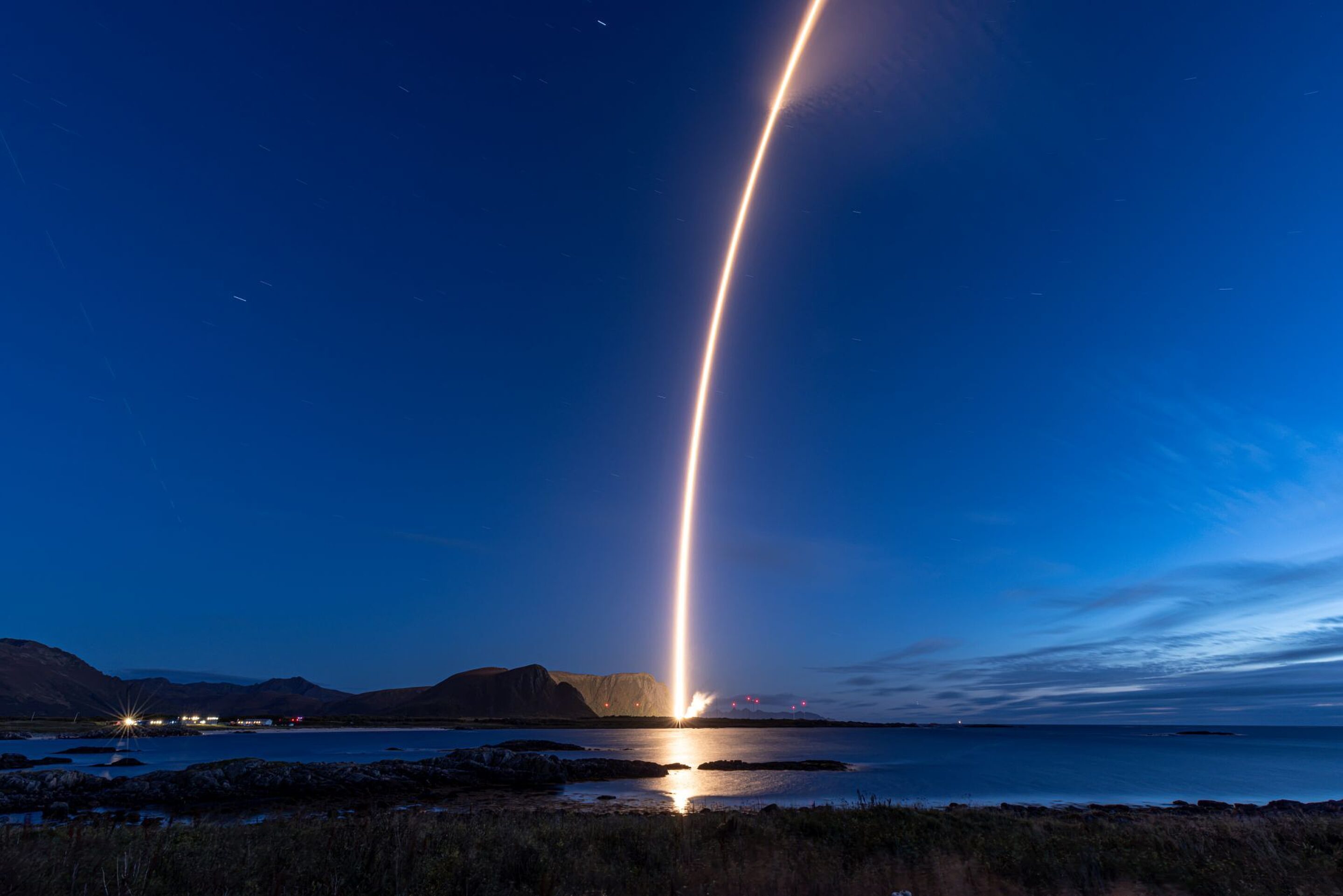Isar Aerospace’s Spectrum rocket climbs above the clouds during its September 2026 orbital mission.