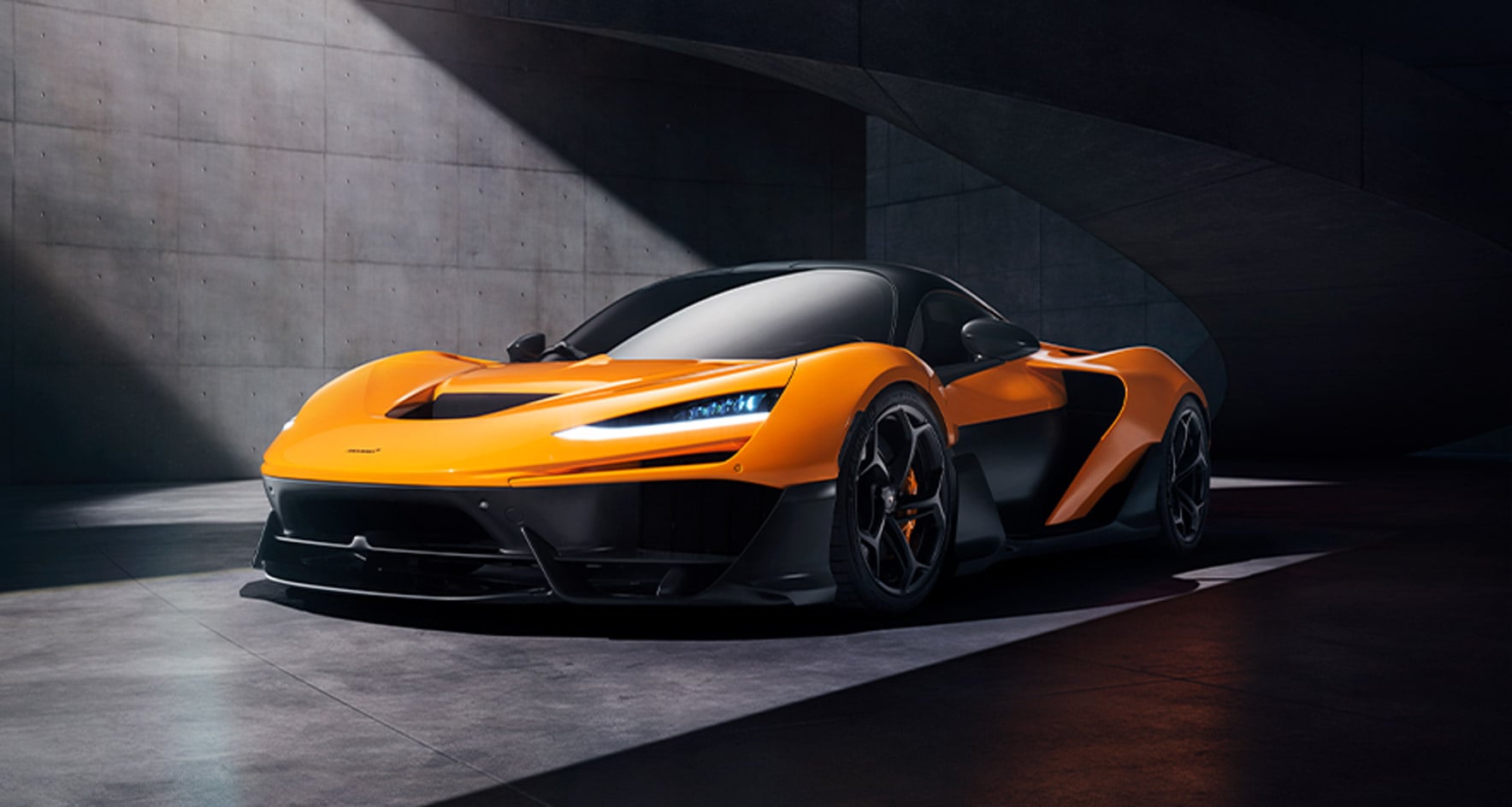 Orange McLaren W1 shown from the front three-quarter angle in an official McLaren image.