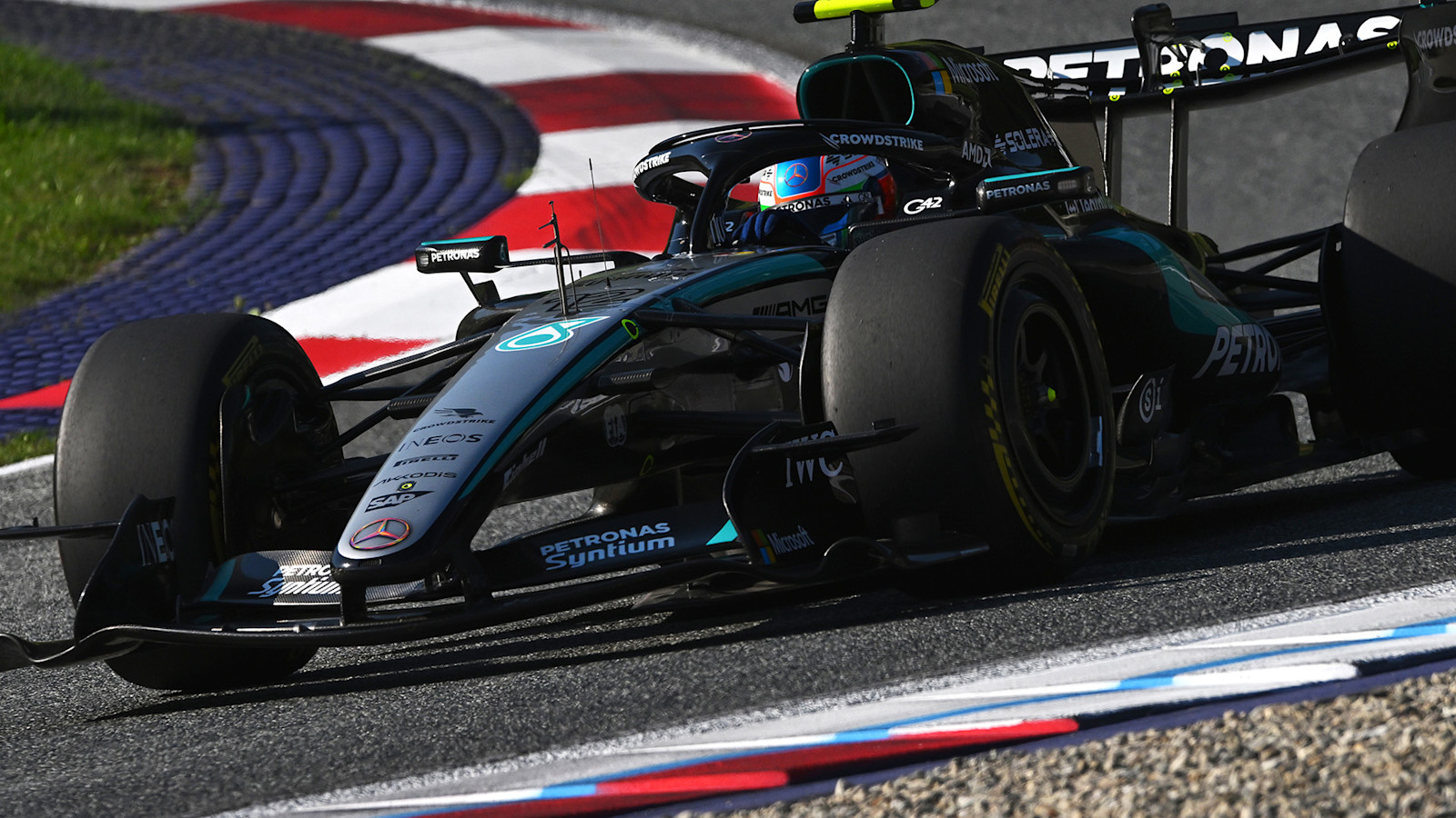 Mercedes Formula 1 car running at the Red Bull Ring during Austrian Grand Prix practice.
