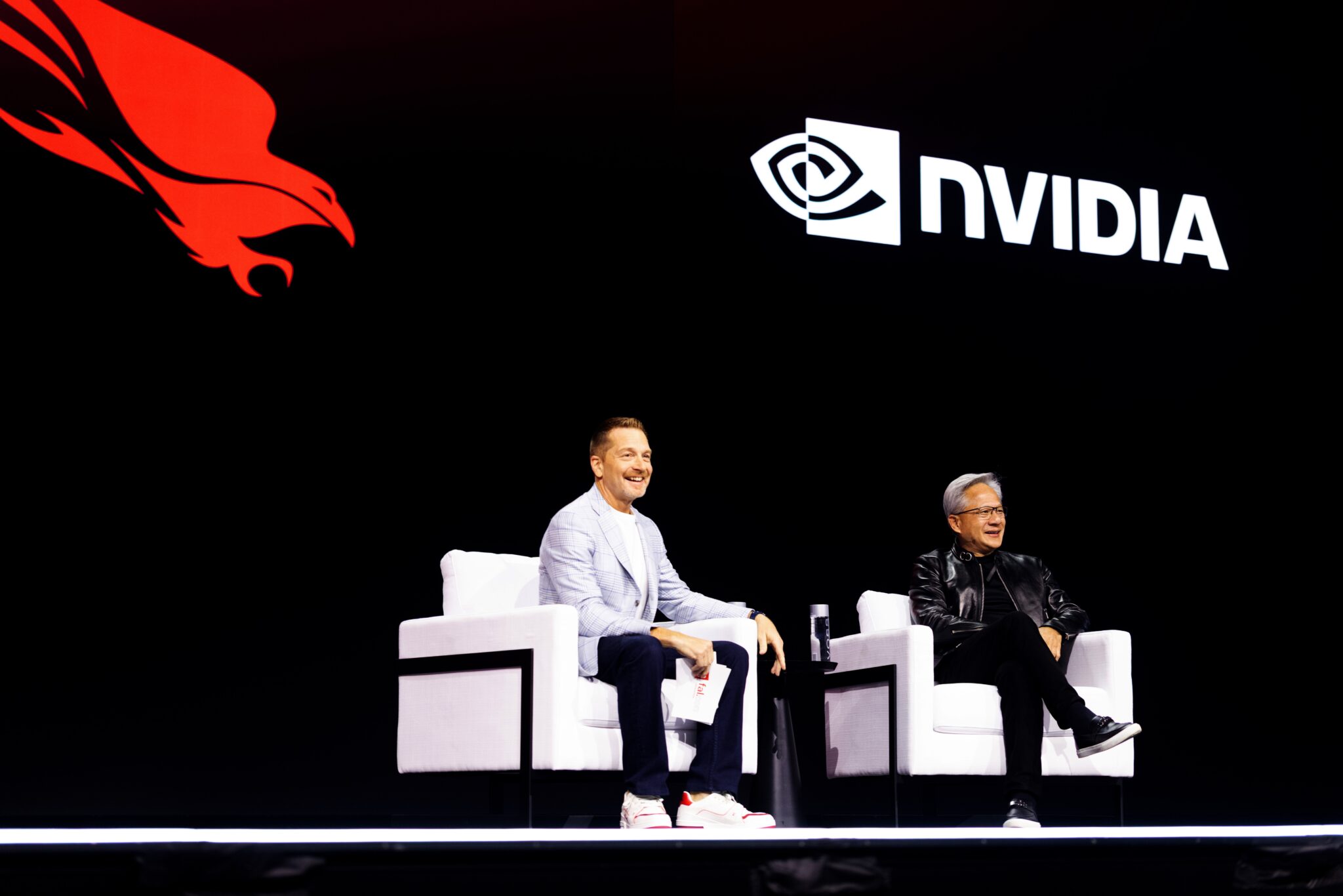 NVIDIA CEO Jensen Huang and CrowdStrike CEO George Kurtz on stage at Fal.Con 2026.