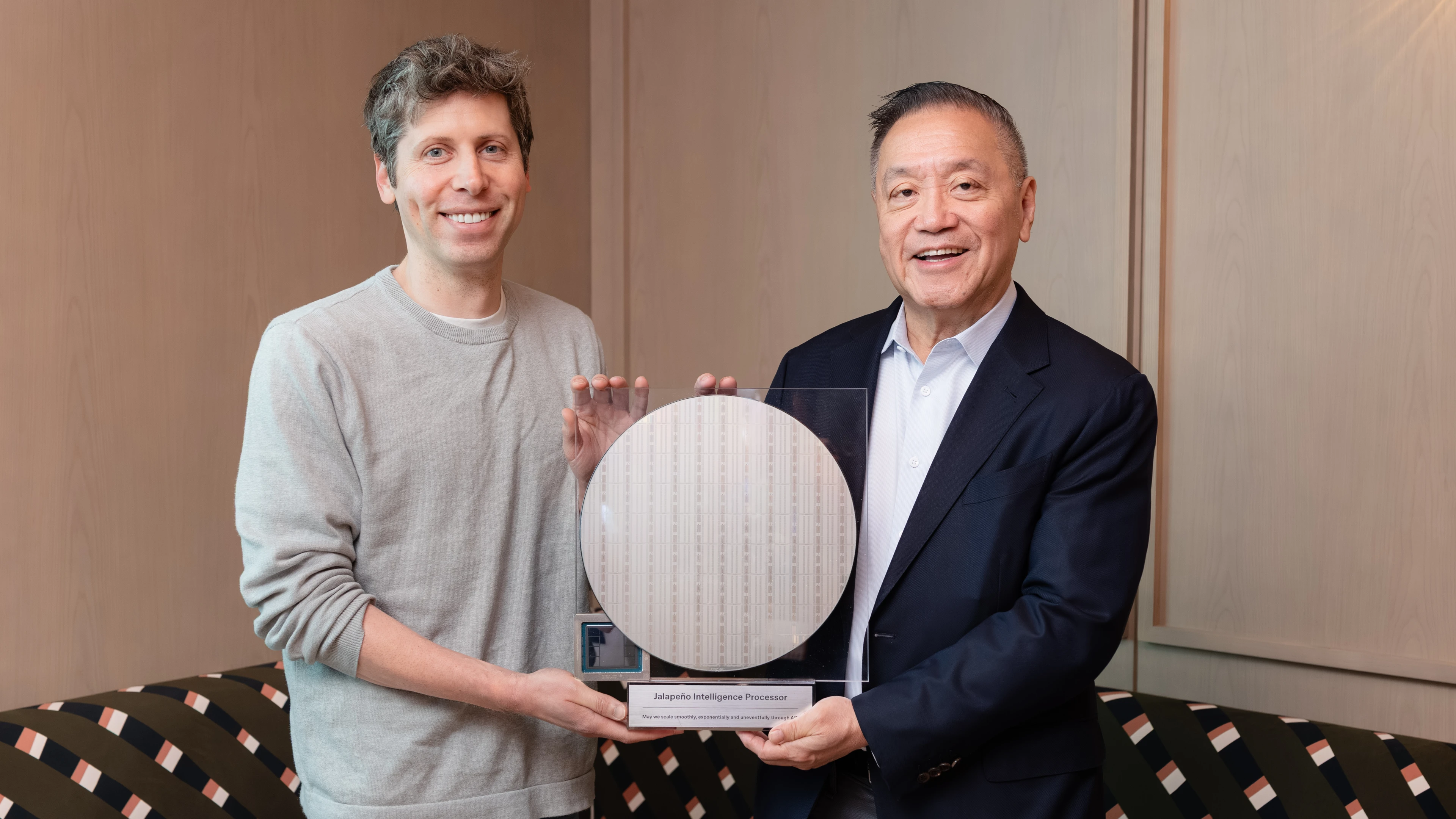 OpenAI and Broadcom leaders holding a Jalapeno inference chip wafer.