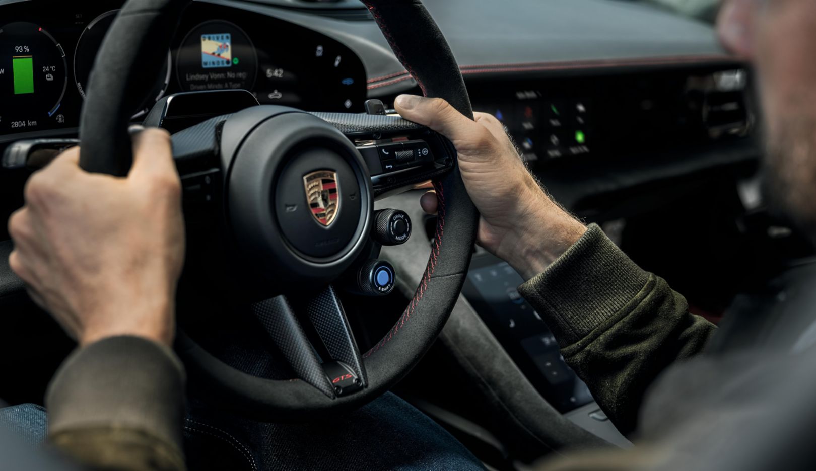 Porsche Taycan GTS steering wheel with E-Shift paddles and mode switch.