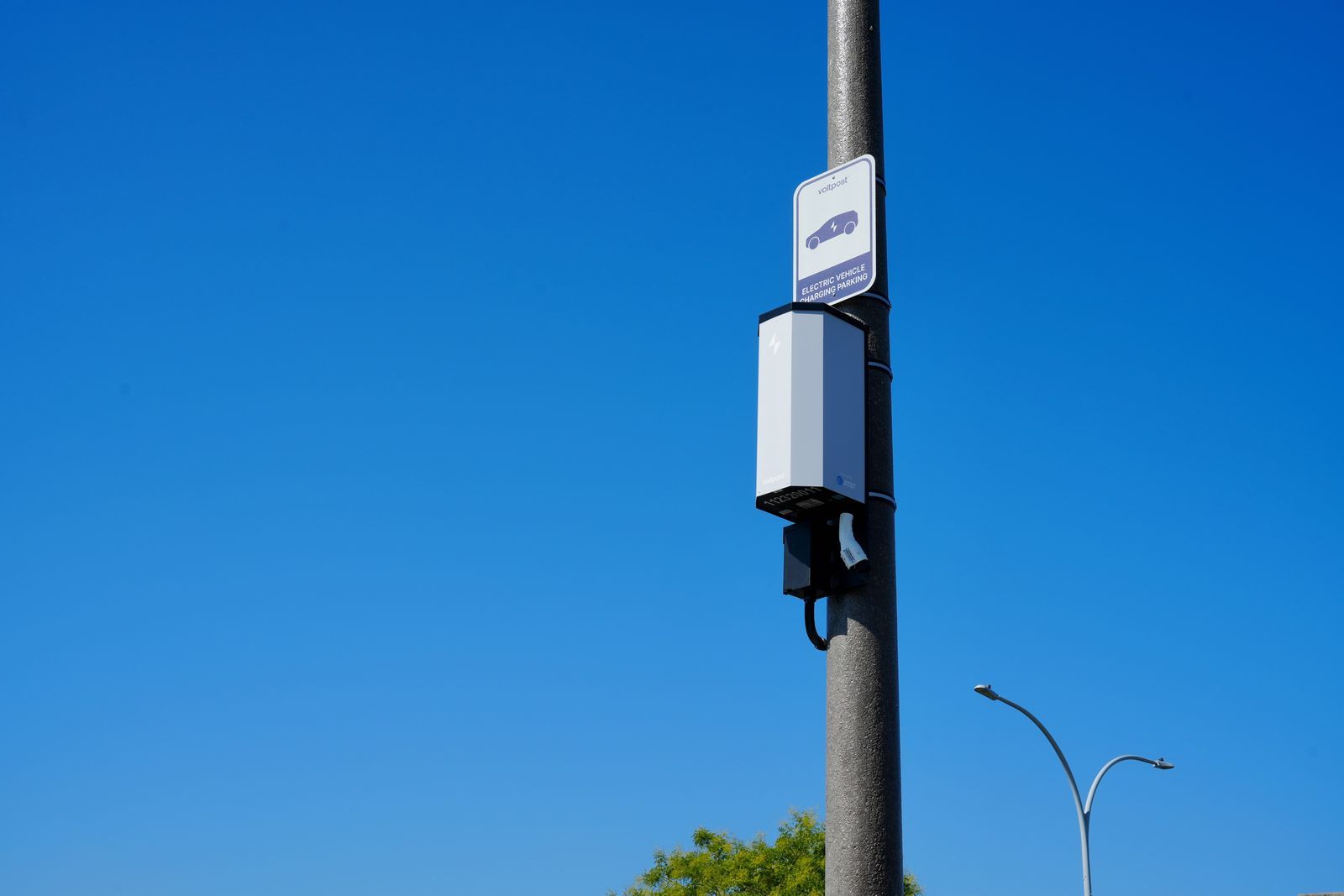 Official Voltpost photo of a lamppost-mounted EV charger in an urban setting.