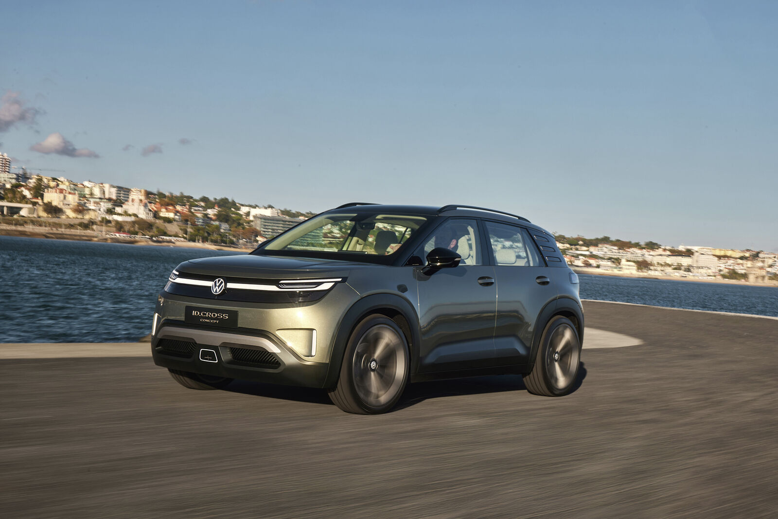 Official Volkswagen image of the near-production ID. Cross electric compact SUV in camouflage on city streets.