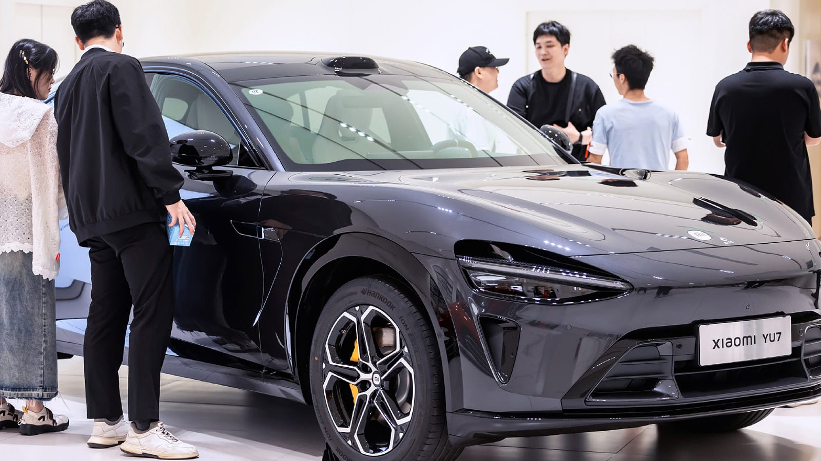 Xiaomi YU7 electric SUV shown in an official Xiaomi EV showroom image.
