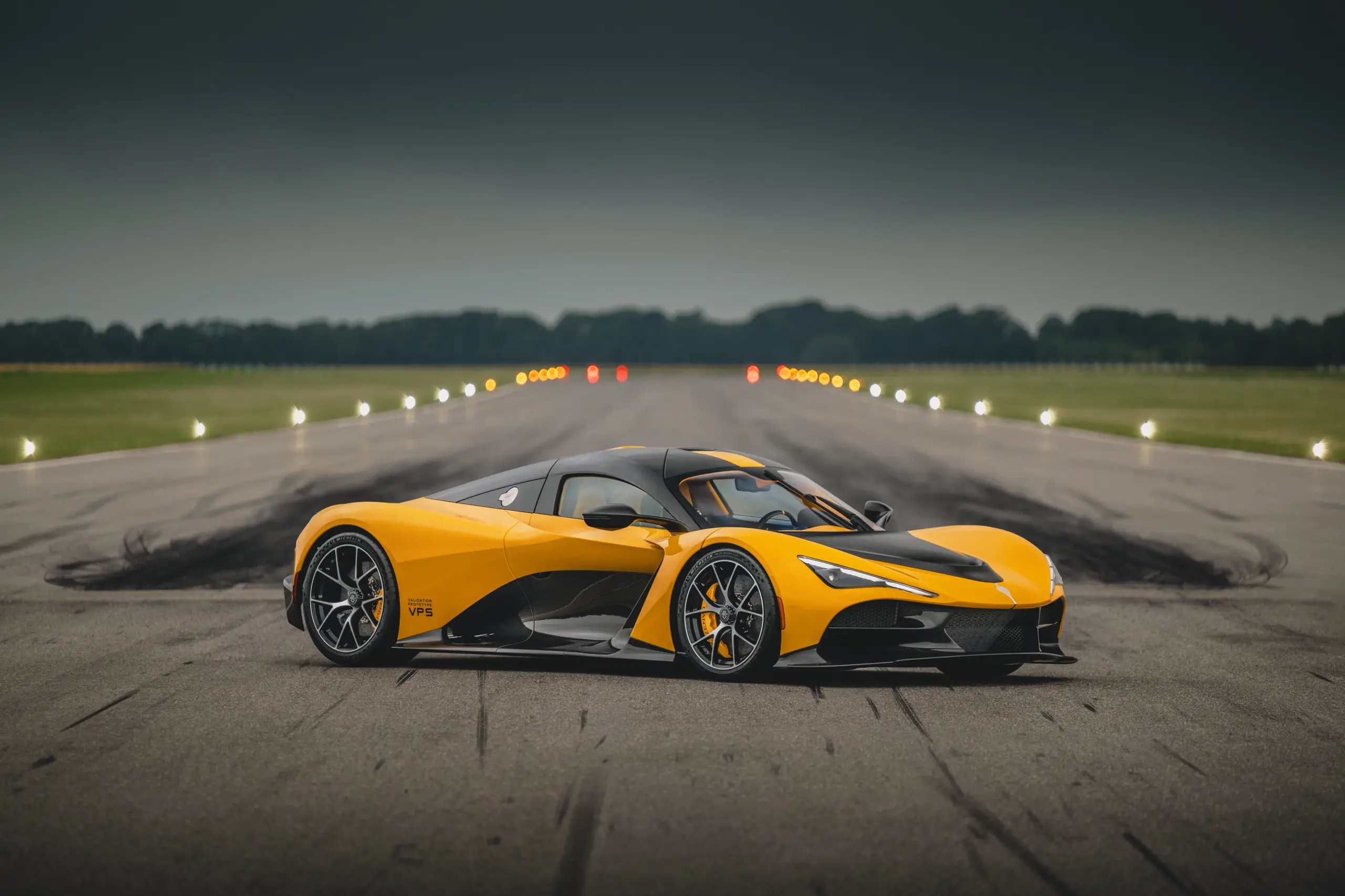 Official Zenvo image of the yellow Aurora Tur validation prototype on a runway.